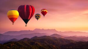 Furious Fiction: August 2024 Story Showcase Hot,Air,Balloon,Above,High,Mountain,At,Sunrise,,Sunset.,View